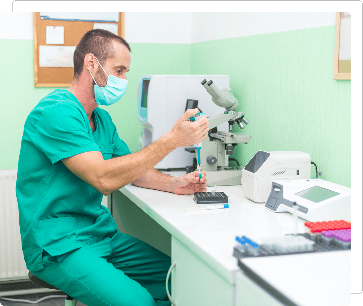 Scientist working in laboratory with microscope.