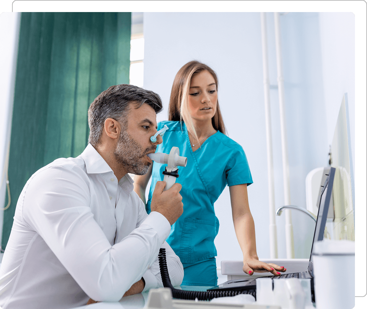 Man undergoing respiratory test with nurse assistance.