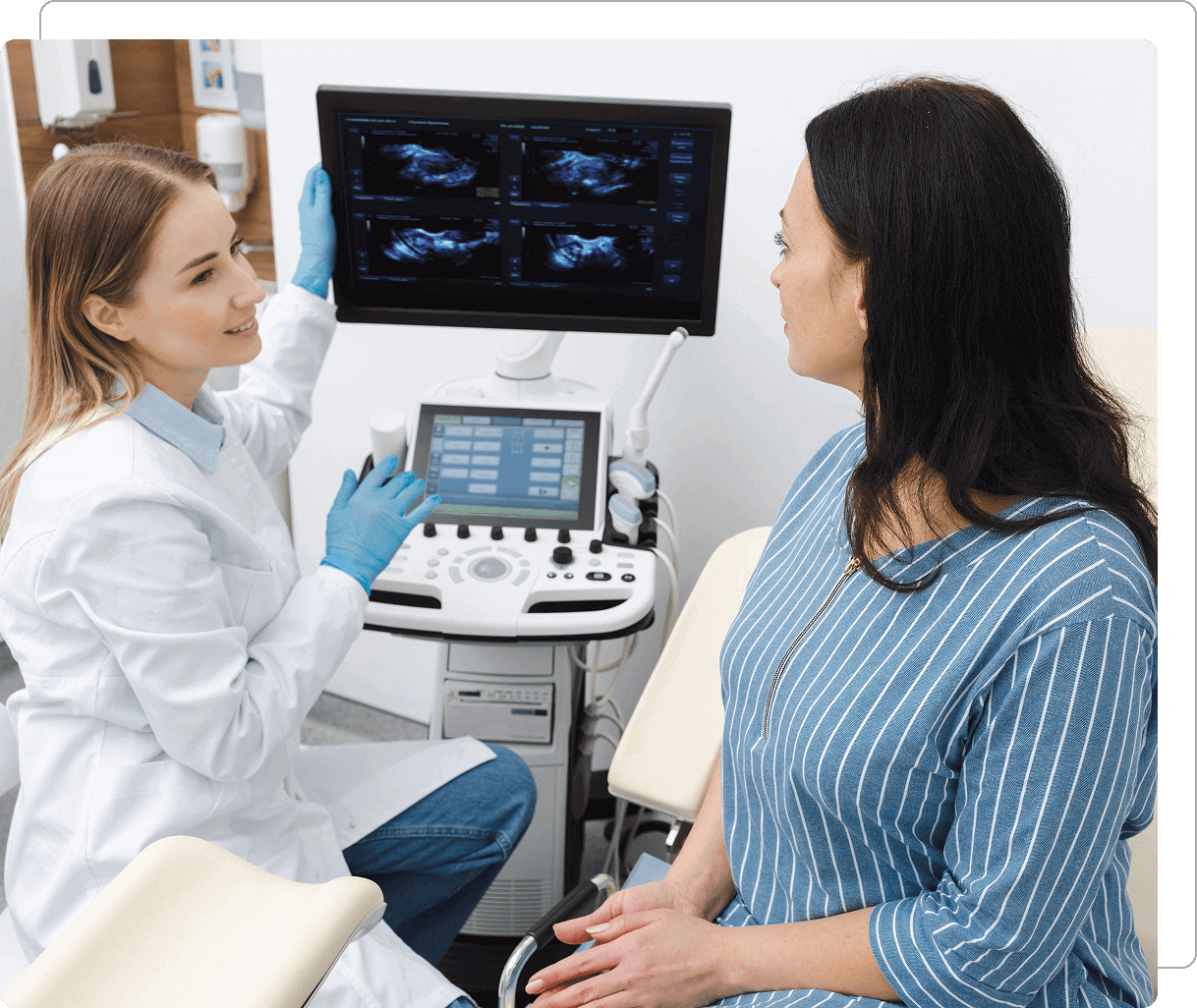 Doctor explaining ultrasound results to patient.