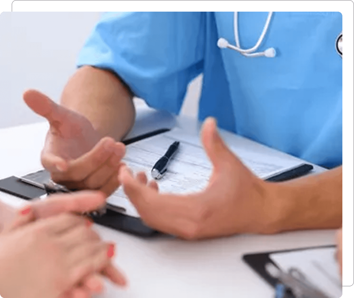 Doctor and patient discussing medical paperwork.